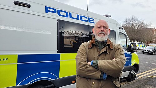 Terry Stacy outside police van
