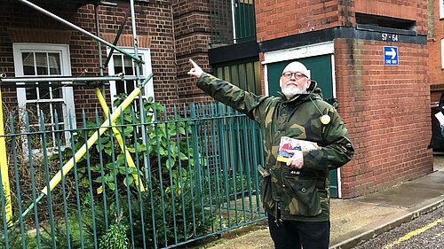 Terry Stacy pointing out Council building works